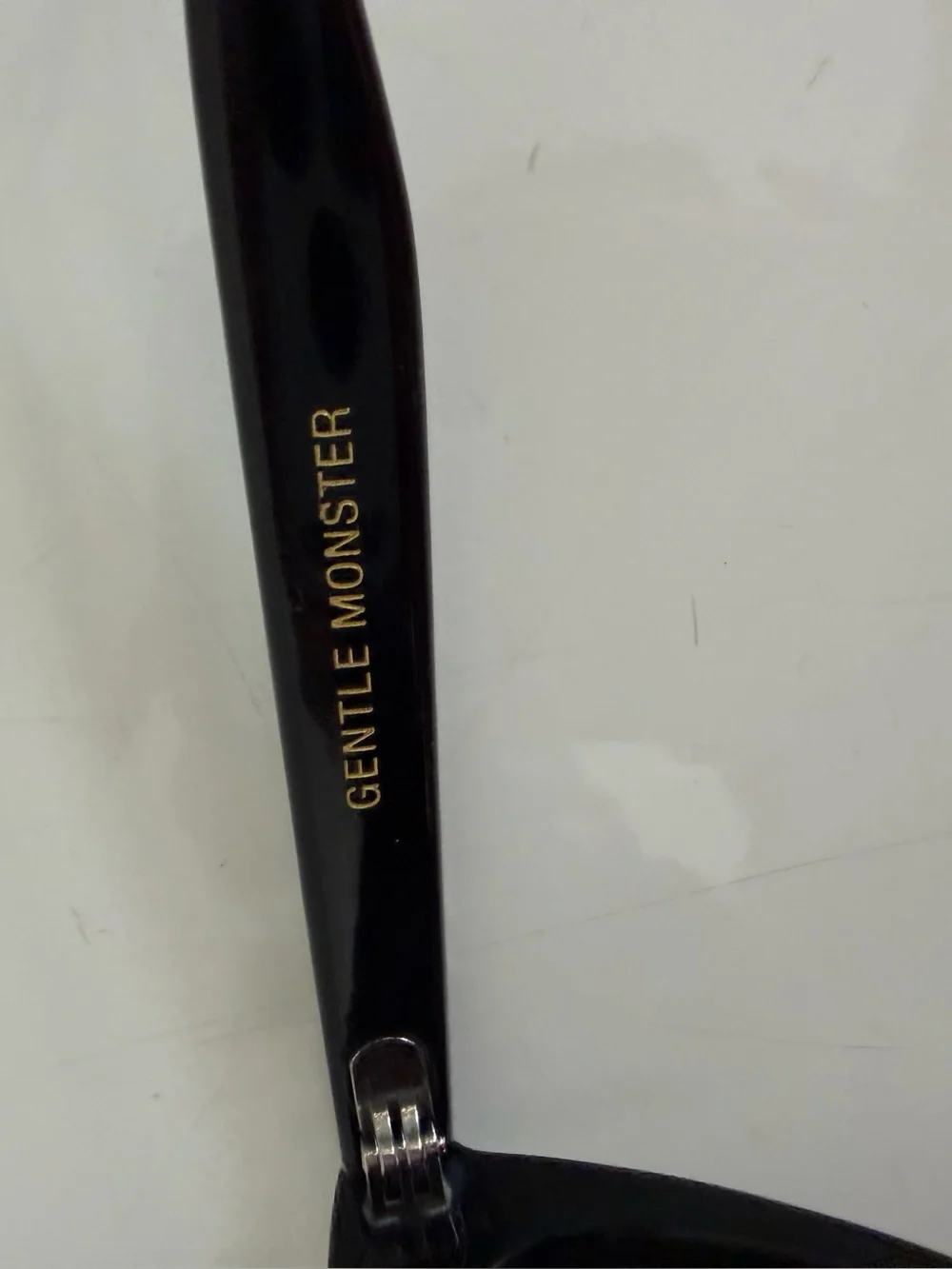 GENTLE MONSTER Black Gloss Cat-Eye Sunglasses with Dark Lenses